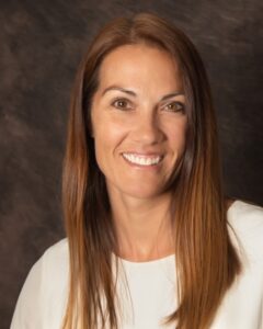 Christa Lo headshot with dark background