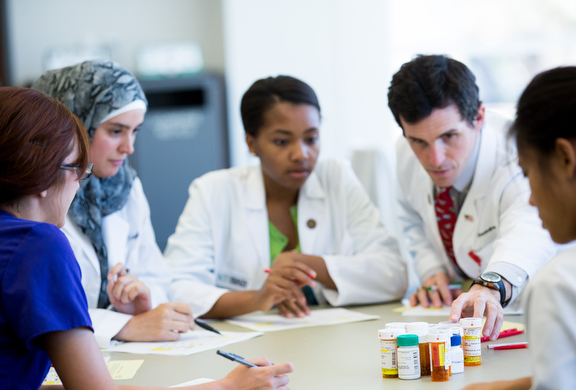 Group of pharmacists observing medications