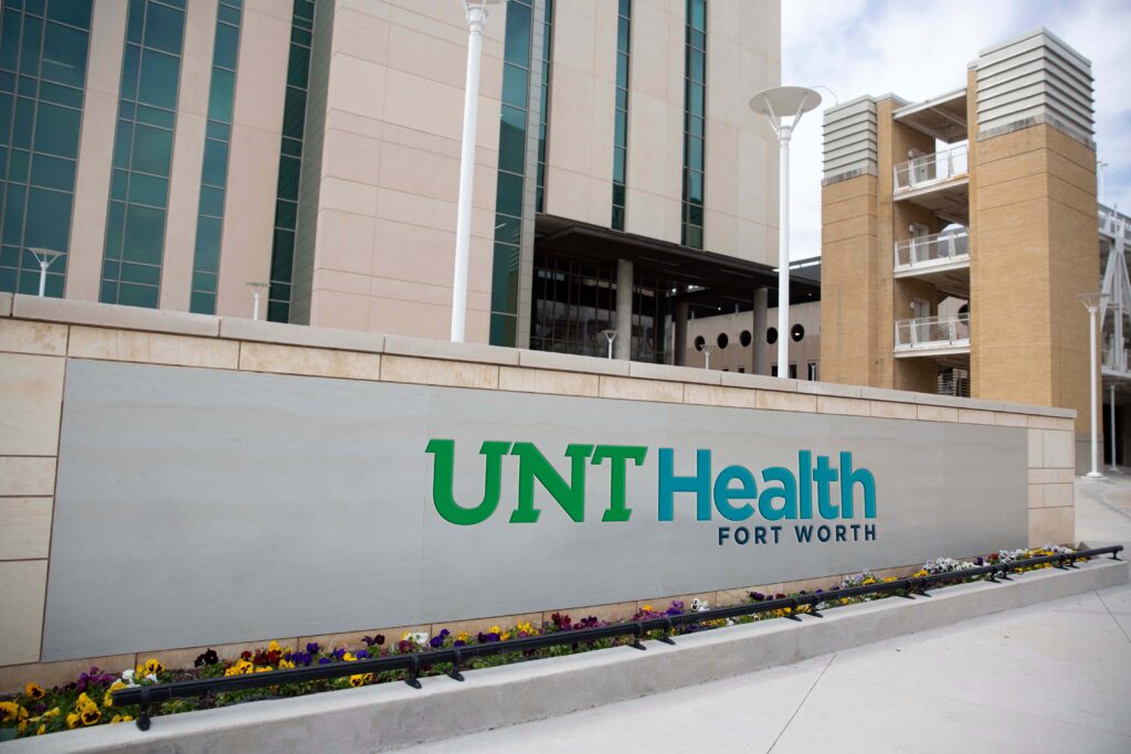 Artist representation of how the new UNT Health logo would look in full color on a campus sign