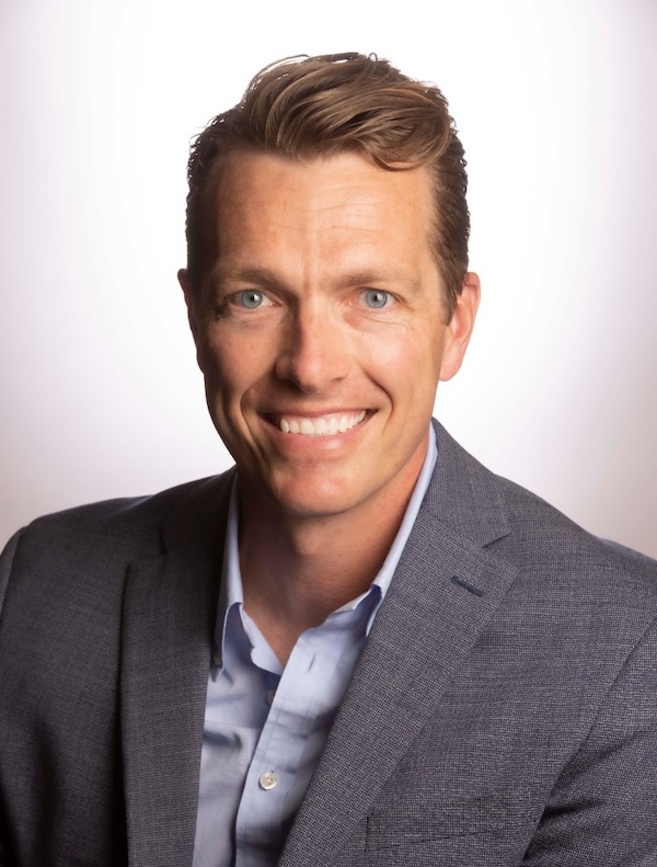 Greg Knell poses for a headshot