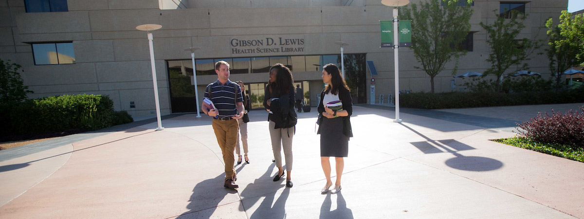 People walking in front of the UNT Health library
