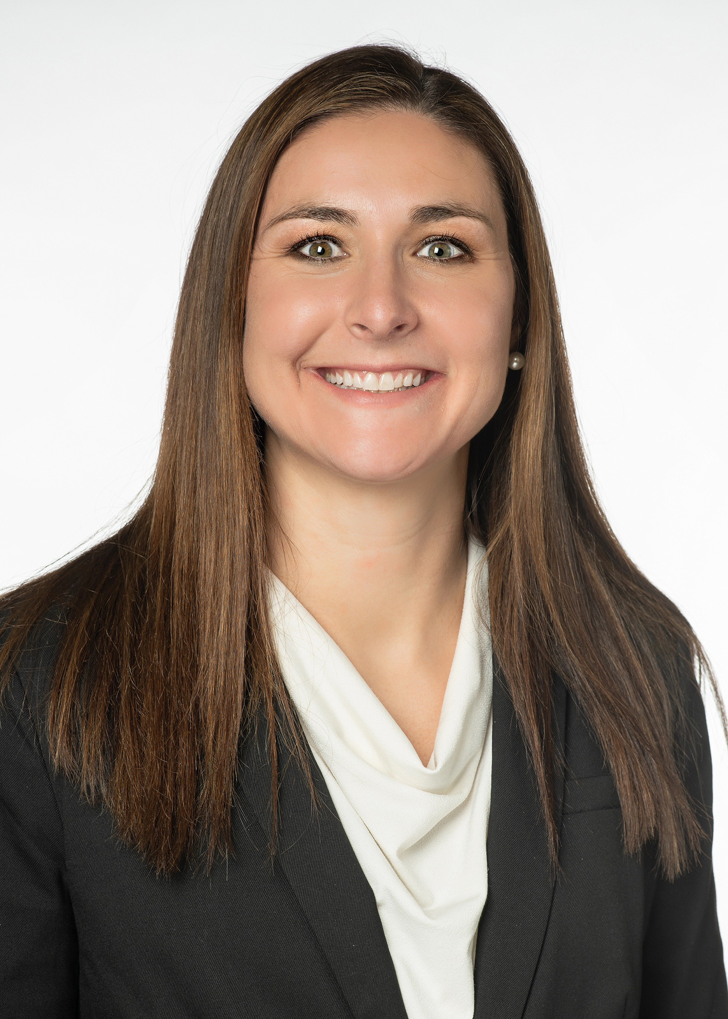 Audrey Lively headshot wearing a blazer with a white shirt underneath