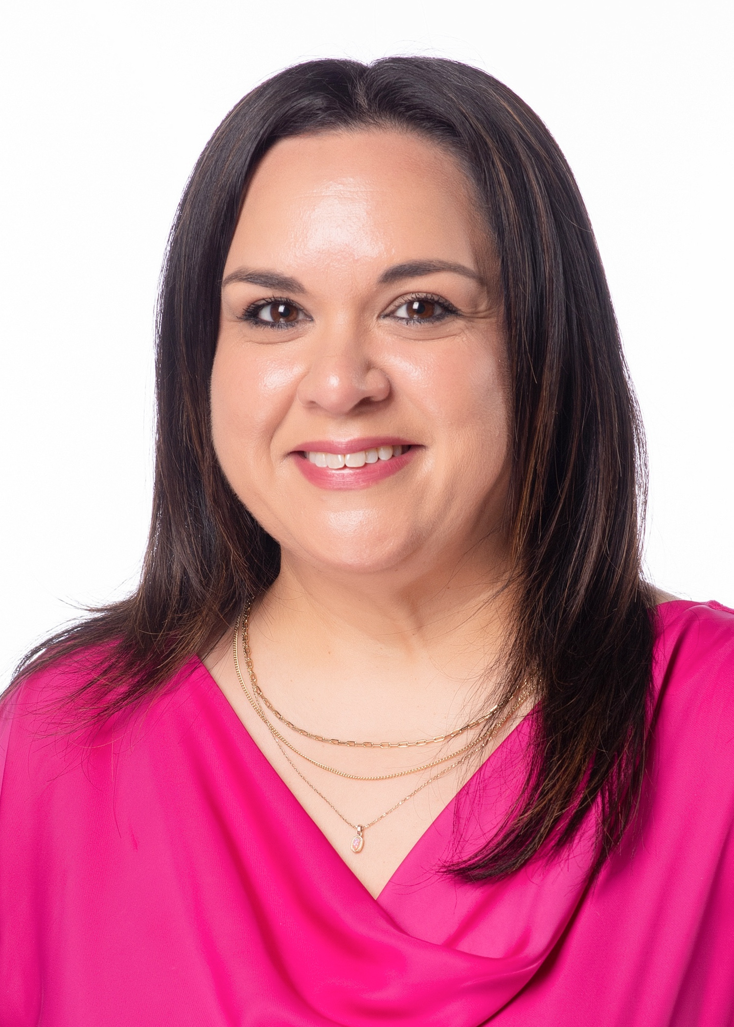Claudia Garcia headshot wearing a pink blouse