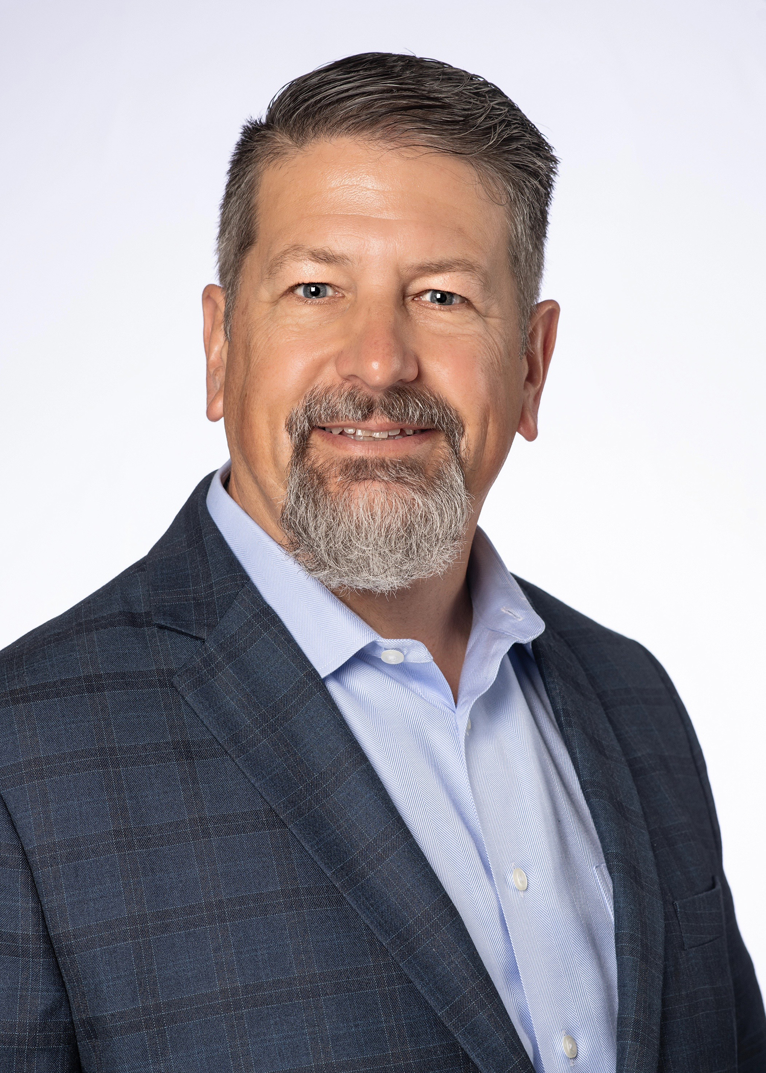 David Mason headshot wearing a dark blue suit jacket