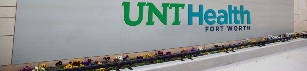 Artist representation of how the new UNT Health logo would look in full color on a campus sign